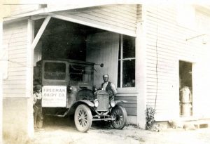 Old photo of man and car
