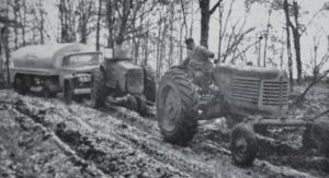 Old photo of tractor stuck in mud